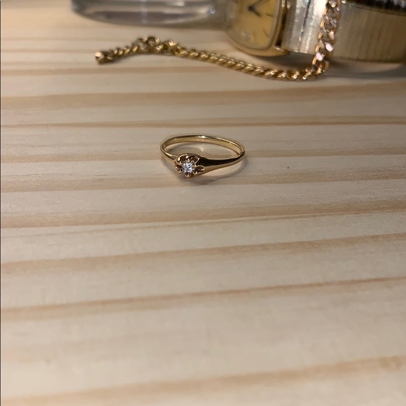 Jewelry - 14 karat gold 1/8th karat diamond ring - size 6 -